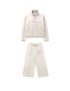 Beige tracksuit with pink accents on a white background